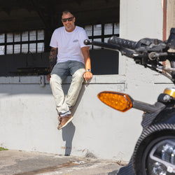 Dan smiling at the camera while wearing our BSMC Garage T Shirt - White & Black