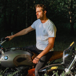 Model sitting on a BMW R Nine T In the forest wearing our BSMC 1580 Roundel T Shirt - White