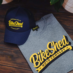 BSMC Classic T-Shirt - Grey folded on a table with our Company Cap in Navy