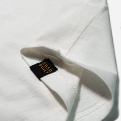 Hem tag close up of our BSMC Company T-Shirt - Off White