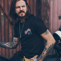 Simon wearing our BSMC Dead Dakar Doug T Shirt - Black