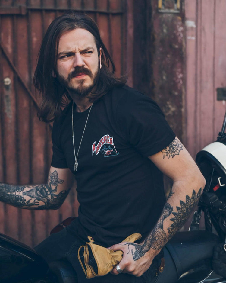 Simon wearing our BSMC Dead Dakar Doug T Shirt - Black