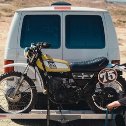 Matching colour Yamaha 250 being transported on the back of a van