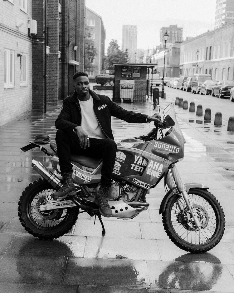 Model sitting on his Yamaha Tenere wearing our BSMC Embroidered Club Waffle - Ecru