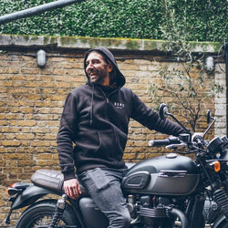 Dan sitting on his Triumph wearing our BSMC ESTD. Hoodie - Black