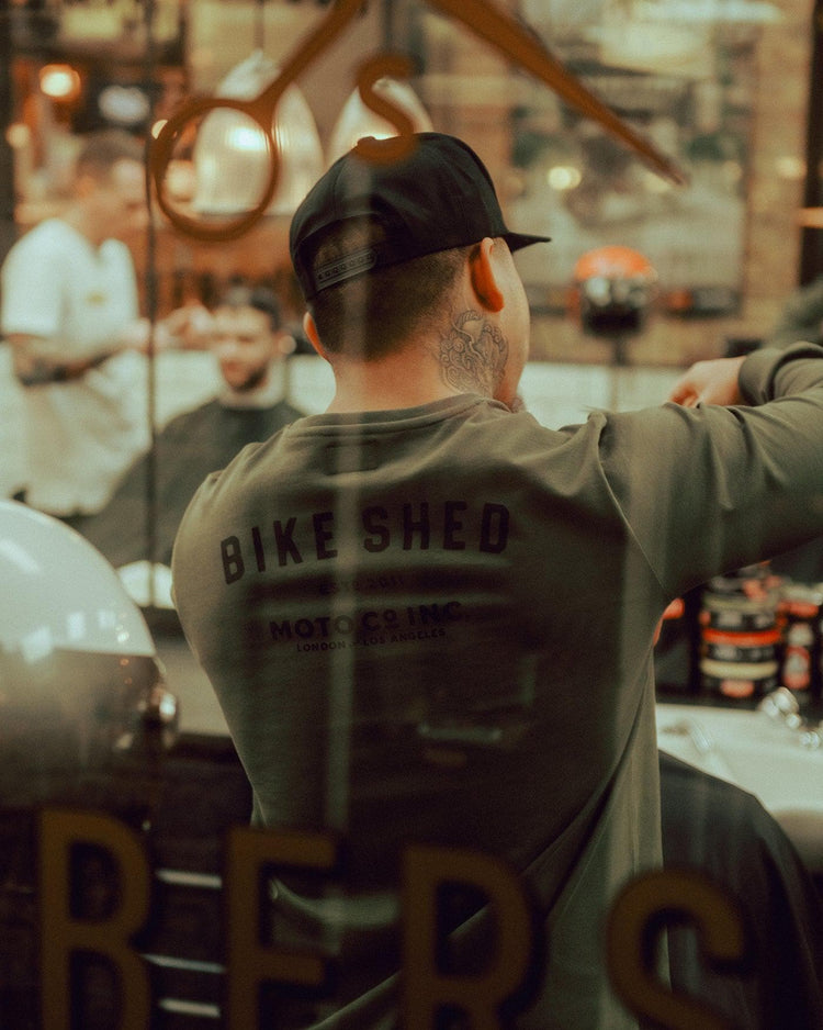Isaac cutting hair while wearing our BSMC Estd. LS220P - Khaki