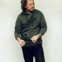 Donny wearing our BSMC Inc. Overhead Hoodie - Khaki Green