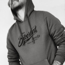 Donny laughing while wearing our BSMC Inc. Overhead Hoodie - Khaki Green