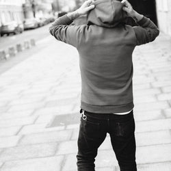Donny adjusting the hood of our BSMC Inc. Overhead Hoodie - Petrol Blue