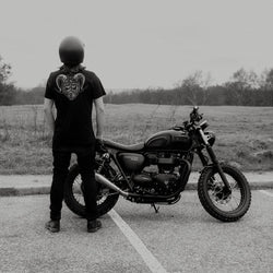 Dan standing next to his bike wearing our BSMC Pan T-Shirt