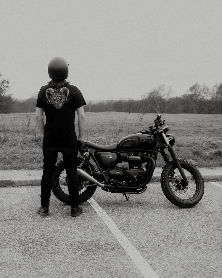 Dan standing next to his bike wearing our BSMC Pan T-Shirt