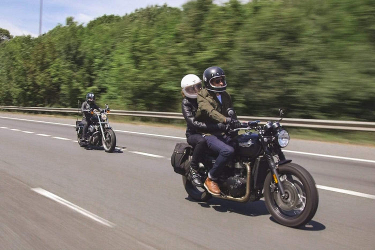 Sam riding his Triumph while wearing our BSMC Protective - Road Jean - Raw Indigo