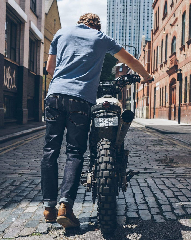Model pushing his Honda wearing our BSMC Resistant - BSR01 Jean - Raw Indigo