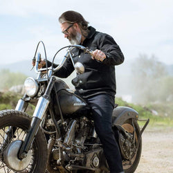 Model wearing our BSMC Resistant - BSR01 Jean - Raw Indigo while sitting on his bike