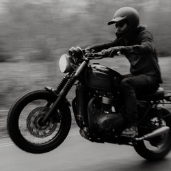 Dan pulling a wheelie wearing our BSMC Ripstop Utility Shirt MKII - BLACK