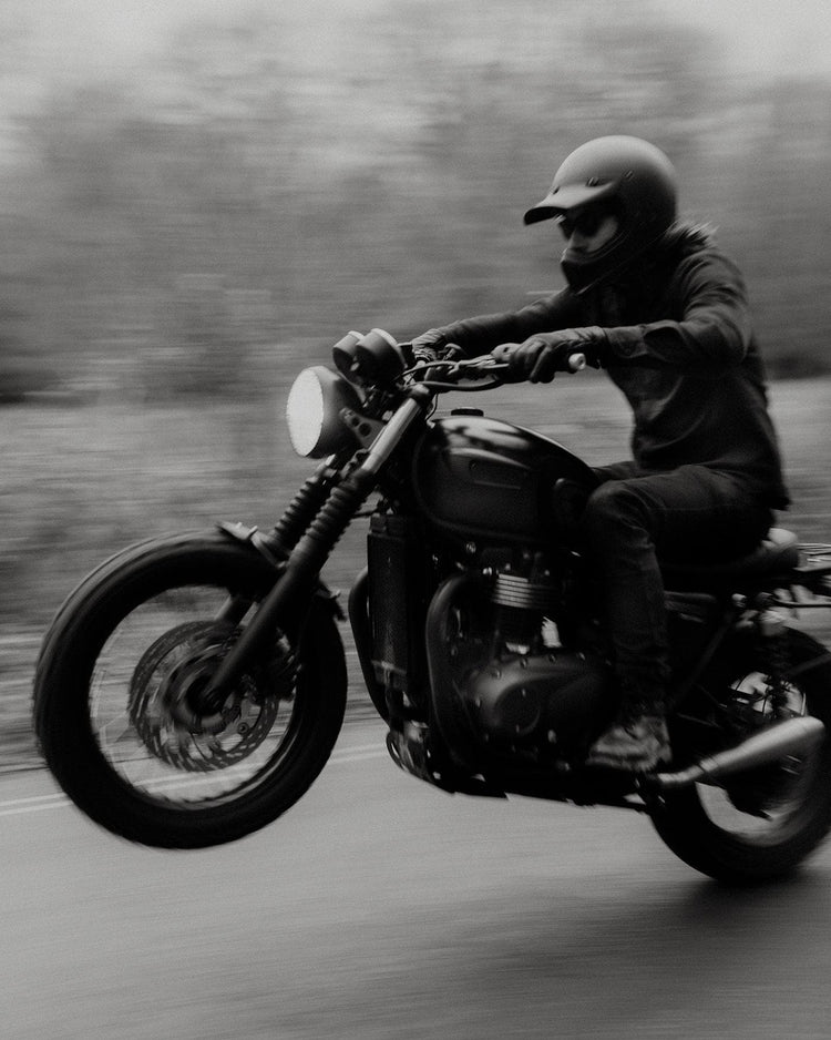 Dan pulling a wheelie wearing our BSMC Ripstop Utility Shirt MKII - BLACK