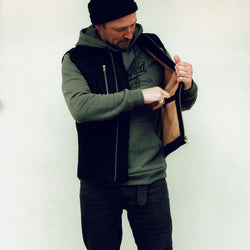 Donny posing wearing our BSMC Utility Vest - Black