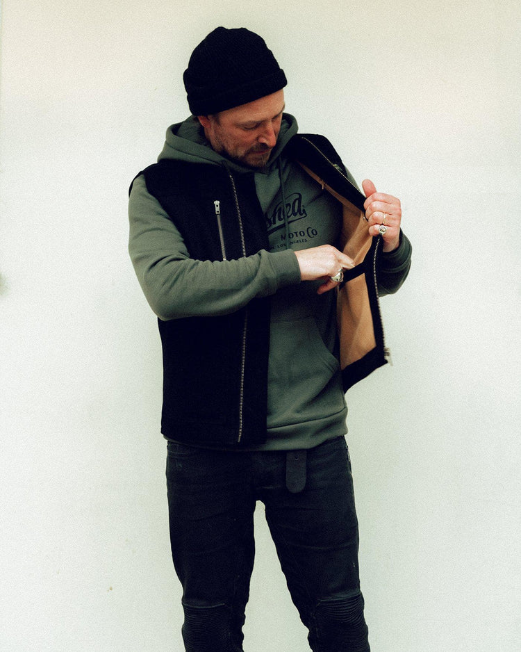 Donny posing wearing our BSMC Utility Vest - Black
