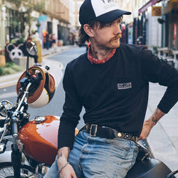 Kane wearing our BSMC x Royal Enfield Aspect Cap - Black & White