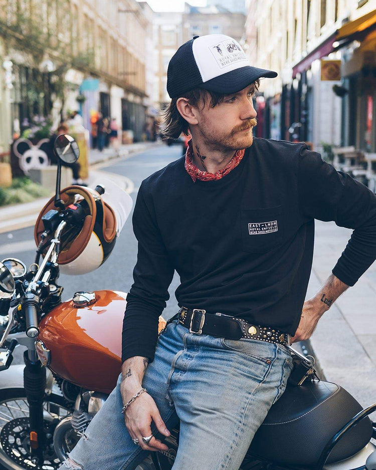 Kane wearing our BSMC x Royal Enfield Aspect Cap - Black & White