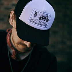 Kane wearing our BSMC x Royal Enfield Aspect Cap - Black & White