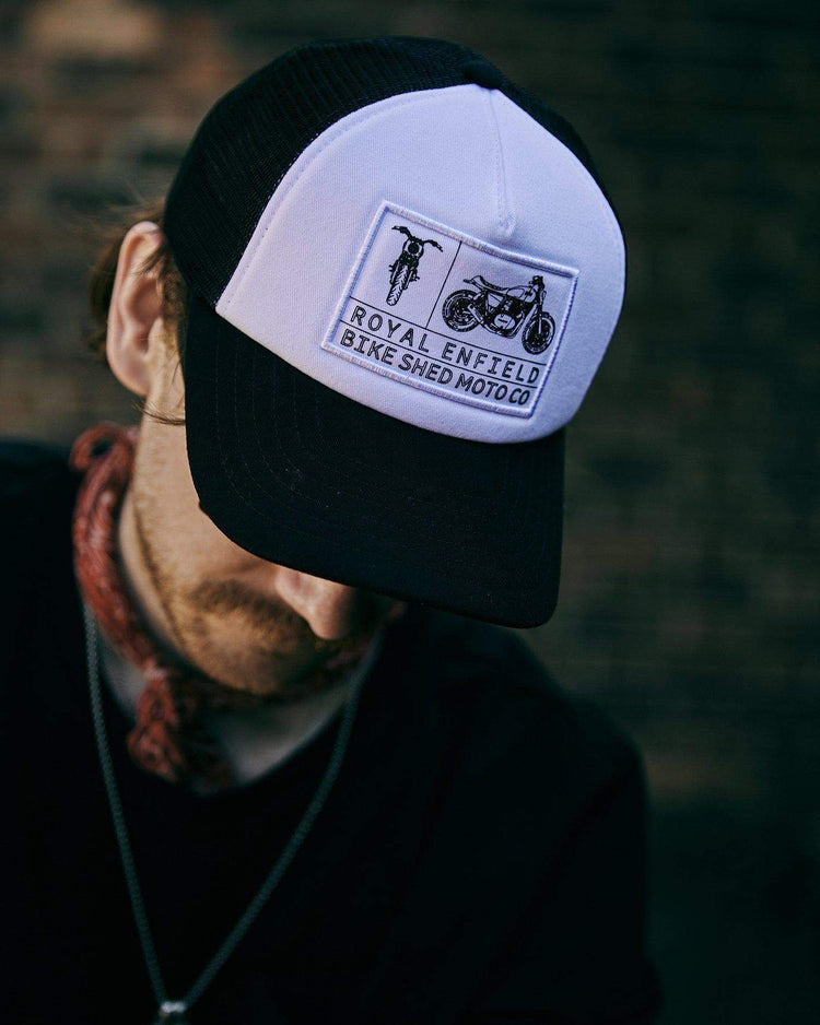 Kane wearing our BSMC x Royal Enfield Aspect Cap - Black & White