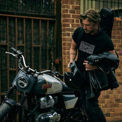 Donny gearing up to ride Dutch's Royal Enfield while wearing our BSMC x Royal Enfield Vinplate T Shirt - Black