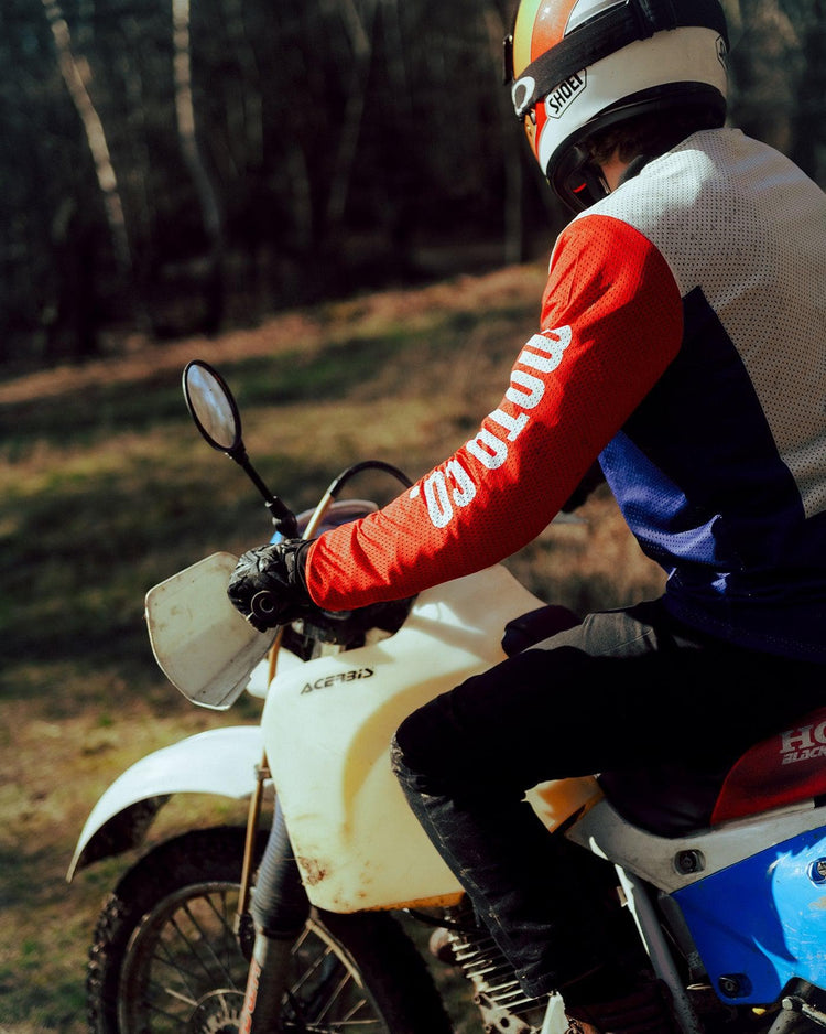 Harry wearing our BSMC XR Race Jersey - WHITE/BLUE/RED riding off road