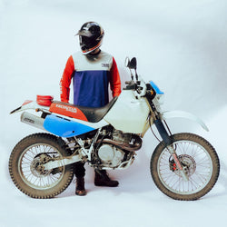 Harry wearing our BSMC XR Race Jersey - WHITE/BLUE/RED on a white back drop