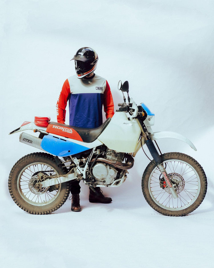 Harry wearing our BSMC XR Race Jersey - WHITE/BLUE/RED on a white back drop