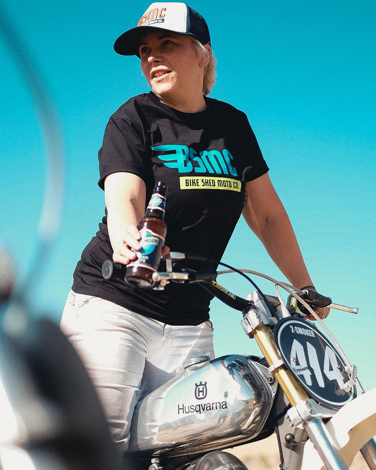 Model wearing our BSMC XT T Shirt - Black standing on a bike