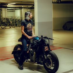 Model sitting on Honda CX500 wearing our BSMC Women's Speed Demon T-Shirt - Washed Black