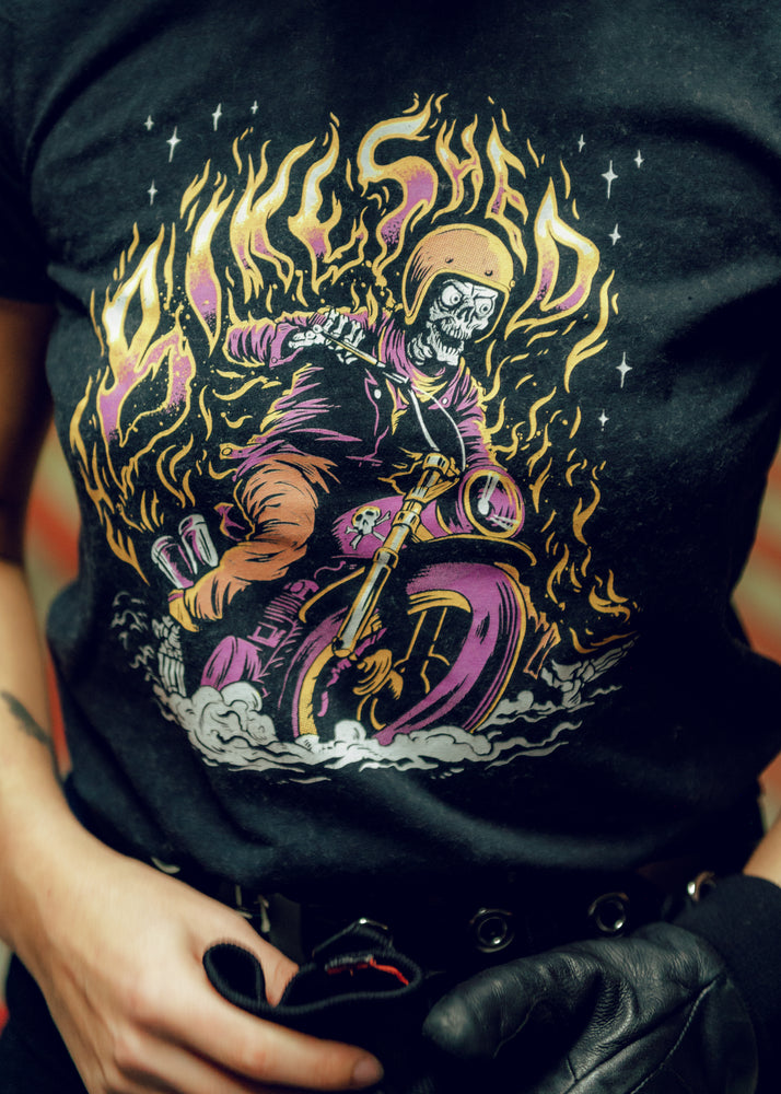 Model wearing our BSMC Women's Speed Demon T-Shirt - Washed Black, logo close up