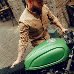 Jimbo wheeling his bike wearing our BSMC Ripstop Utility Shirt MKII - TAN