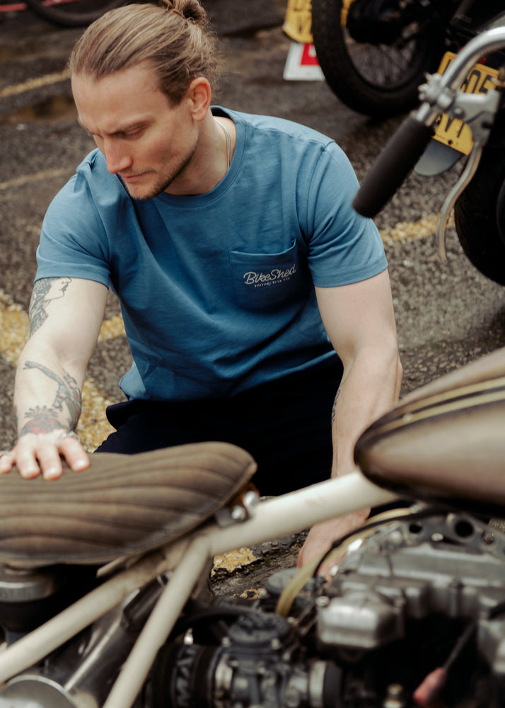 Steve inspecting a chopper wearing our BSMC Chain Slub T Shirt - Blue