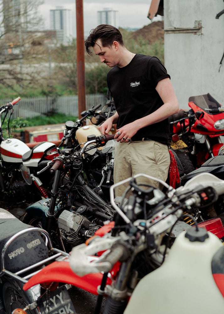 Joe inspecting bike in our BSMC Chain Slub T Shirt - Black
