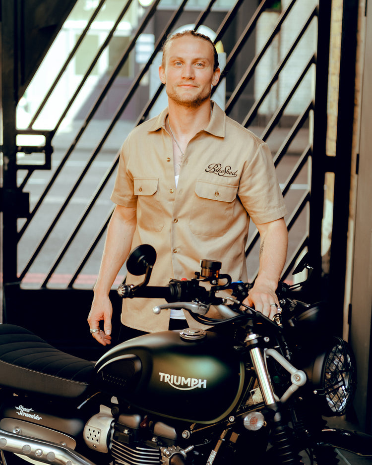 Steve with his Triumph wearing our BSMC Garage Shirt - Tan & Black