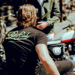Harry chatting while wearing our BSMC Garage T Shirt - Black & Gold