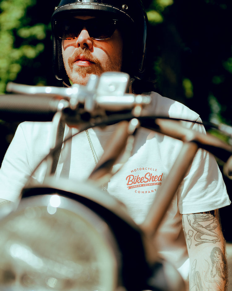 Close up of James wearing our BSMC Company T-Shirt - Off White