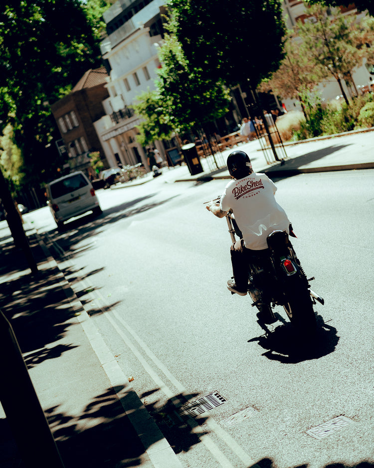 James riding his Harley in the sun wearing our BSMC Company T-Shirt - Off White