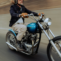 John wearing our BSMC Denim Jacket - Resistant Indigo riding his Triumph