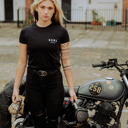 Model wearing our BSMC Women's ESTD. Pocket T Shirt - Black next to her Mutt