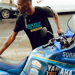 Model wheeling his bike wearing our BSMC XT T Shirt - Black
