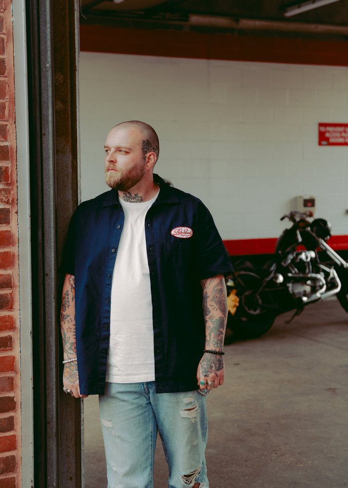 Liam posing in our BSMC Garage Patch Shirt - Navy
