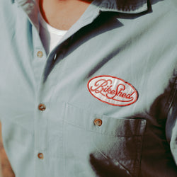 Dan wearing our BSMC Garage Patch Shirt - Blue, close up