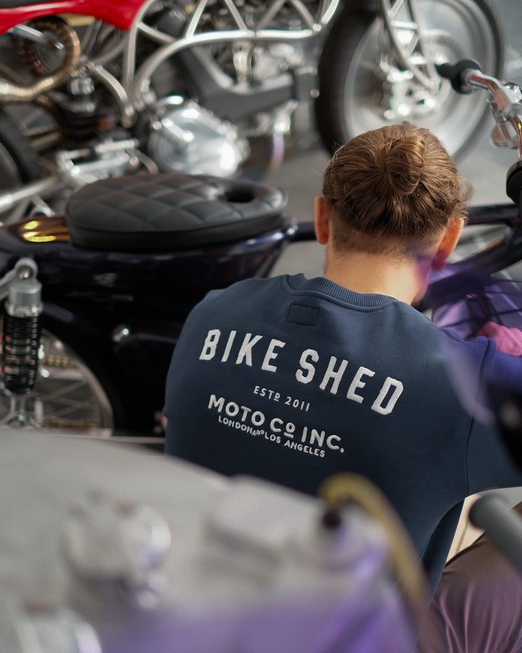 Steve wearing ESTD Embroidered Sweatshirt, back print 
