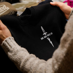 Zeus Embroidered Sweatshirt Black in store close up of chest logo