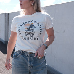 Brogan wearing our BSMC Women's Sunset T-Shirt - Off White