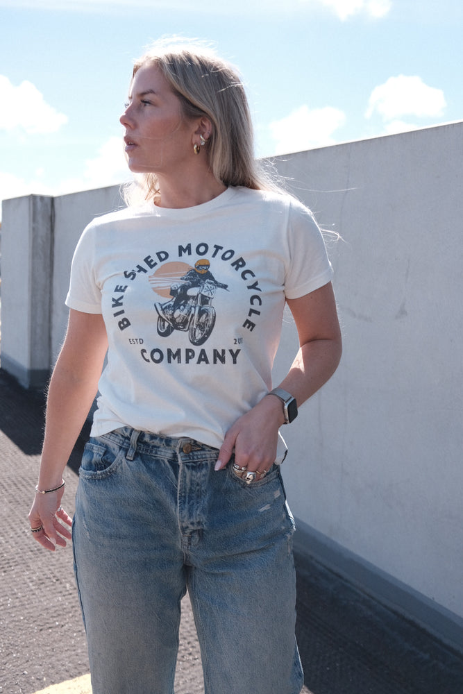 Brogan wearing our BSMC Women's Sunset T-Shirt - Off White