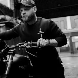 Jimbo wearing Zeus Embroidered Sweatshirt Black in the rain